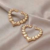 Elegant 18K gold-plated heart hoop earrings, combining charm and sophistication for any jewelry collection.